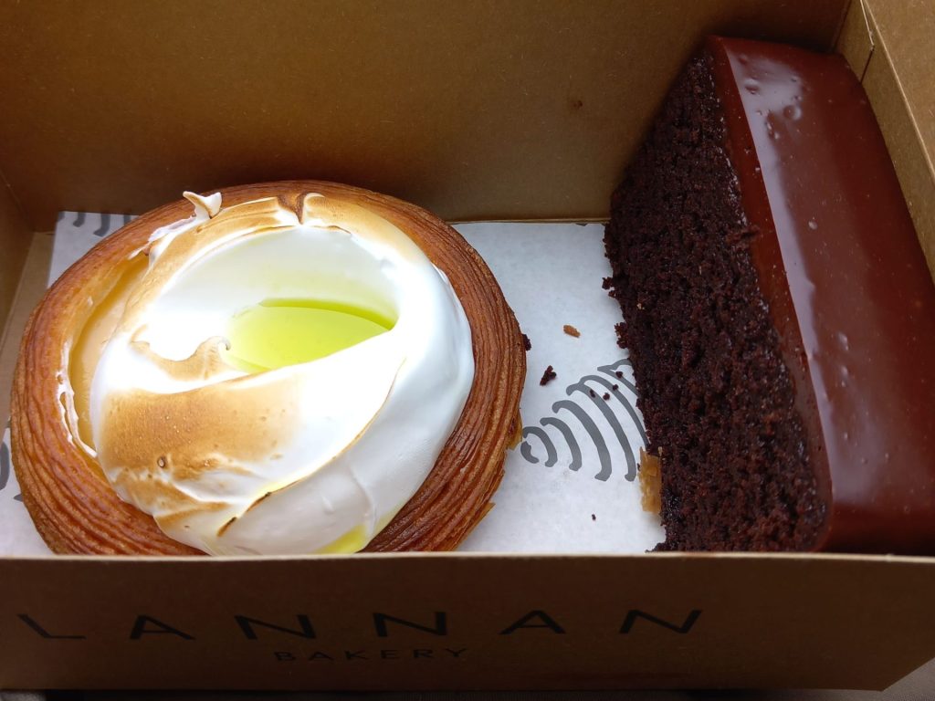 Lemon meringue and chocolate cake in a box