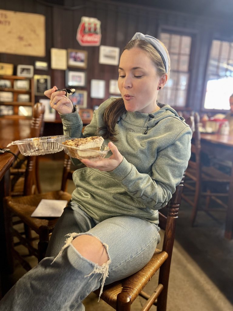 Woman in restaurant eating a dessert