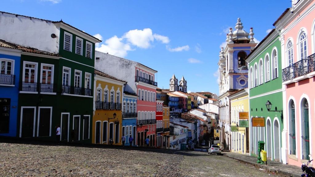 Street with colourful buildings sloping downwards