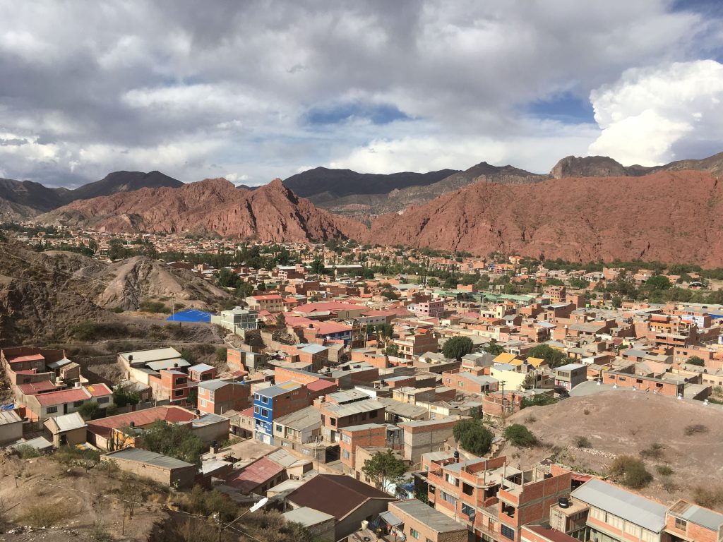 View of city from above with gorges and ravines surrounding it.