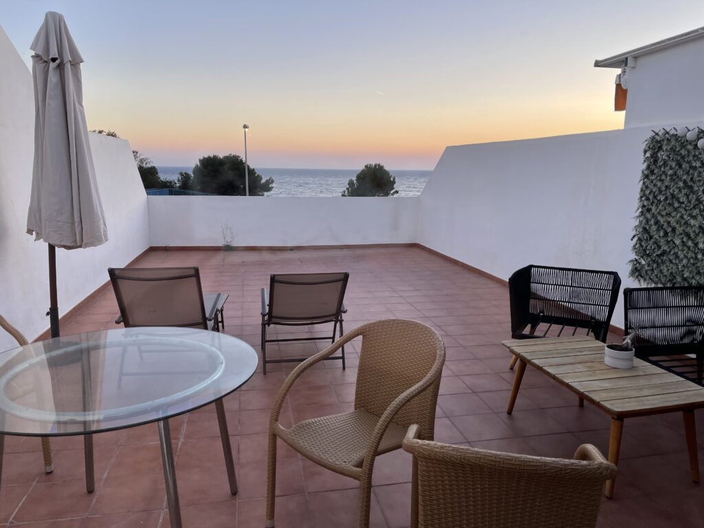 Balcony with furniture, overlooking the sea
