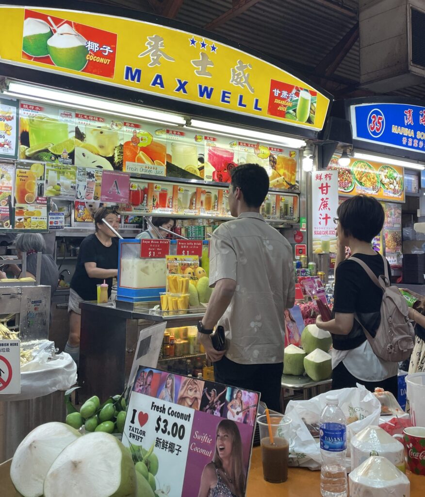 Man and woman in queue at street food stall