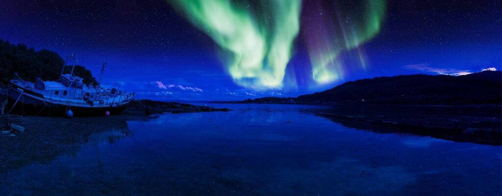Lake at night with aurora phenomenon above