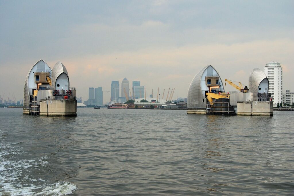 River barriers with skyscraper backdrop