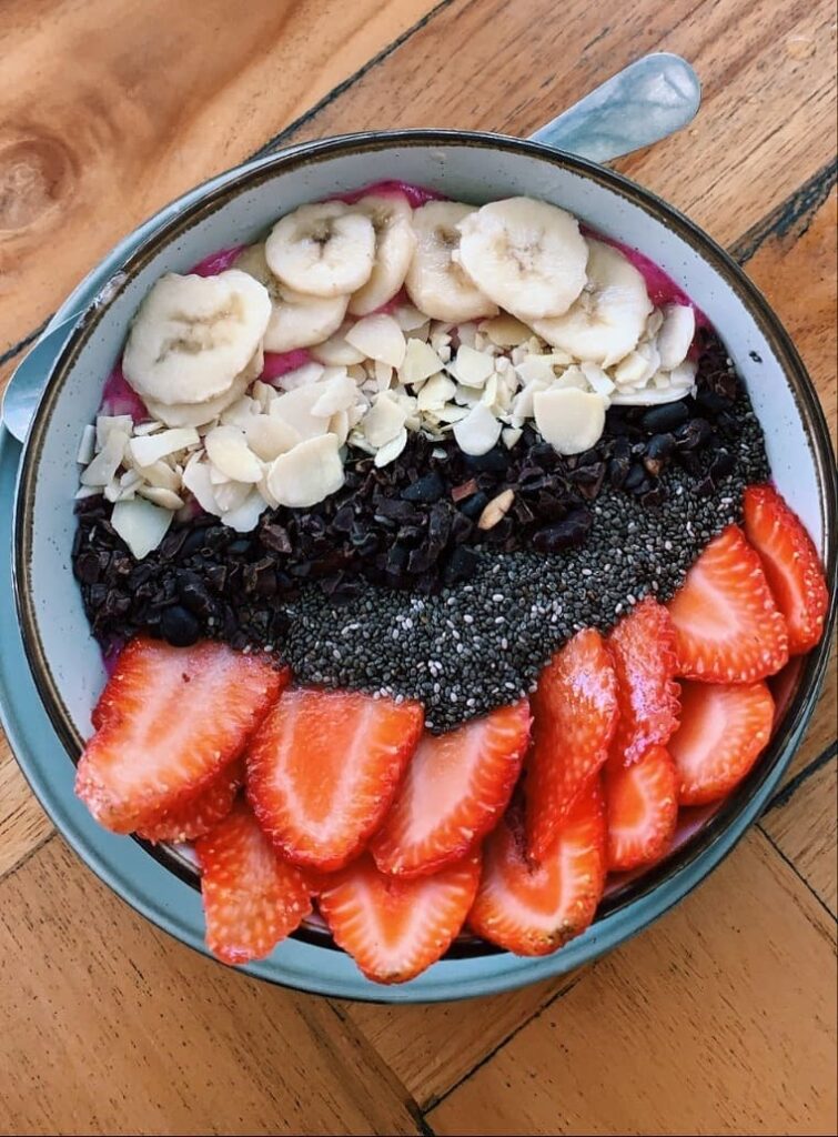 Bowl with banana, strawberry and nuts