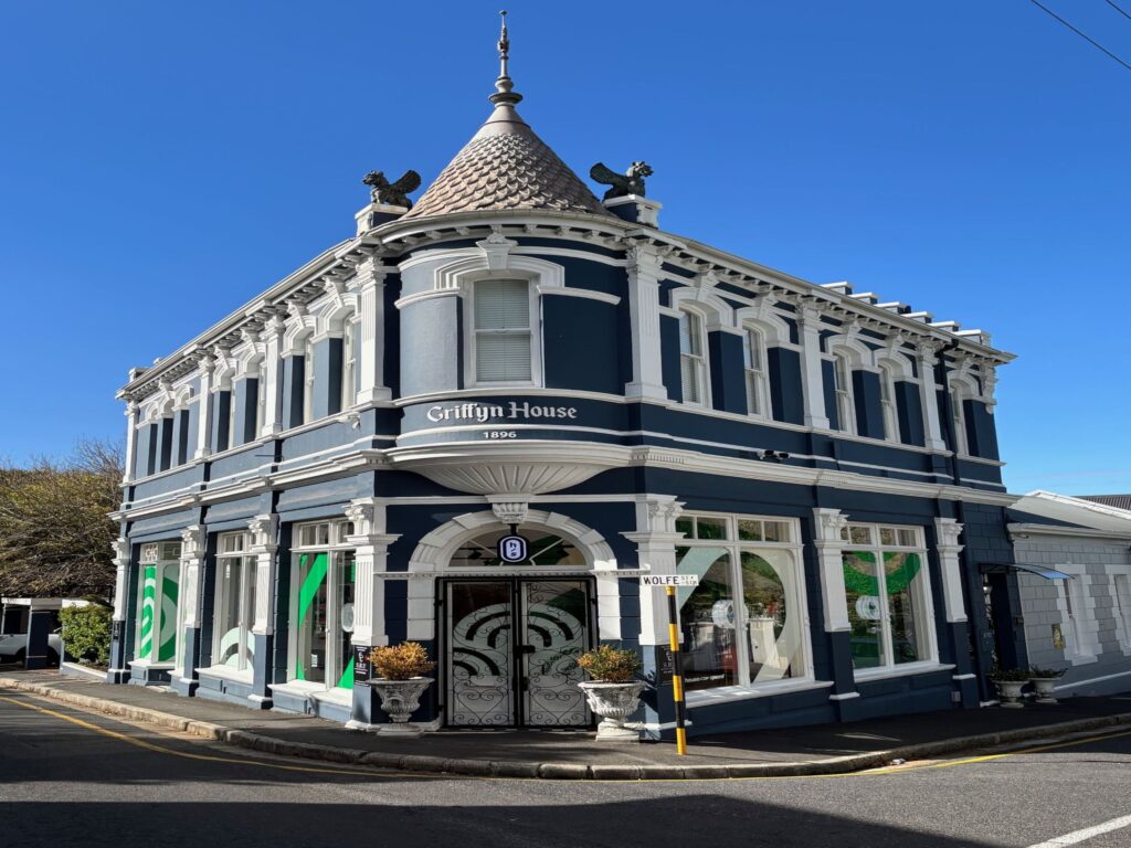 An ornate house with a turret at a junction