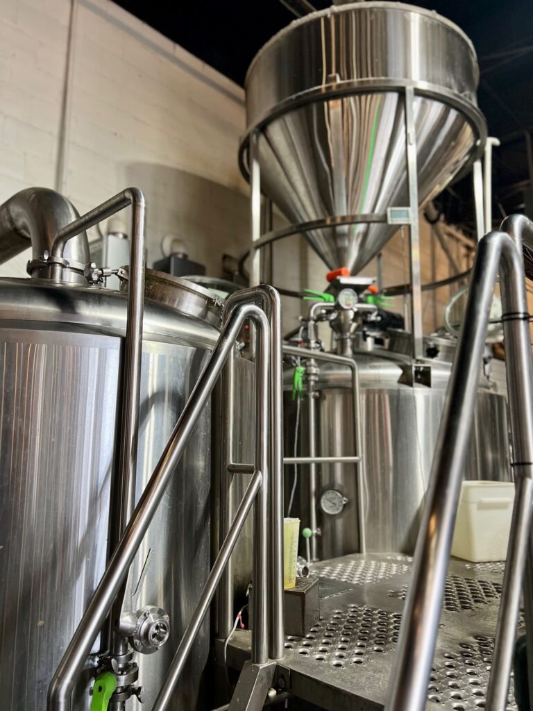 Brewery equipment with kettle and storage tanks