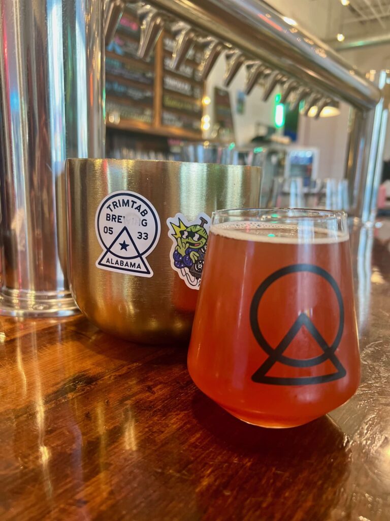 Glass of sour beer on a wooden bar