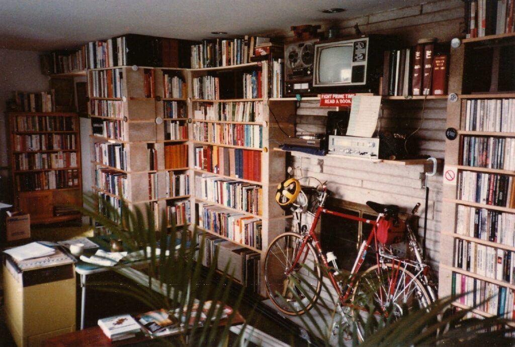 Living room with bike among bookshelves