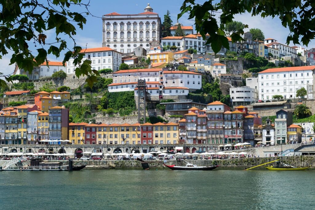 Buildings rising from the river bank
