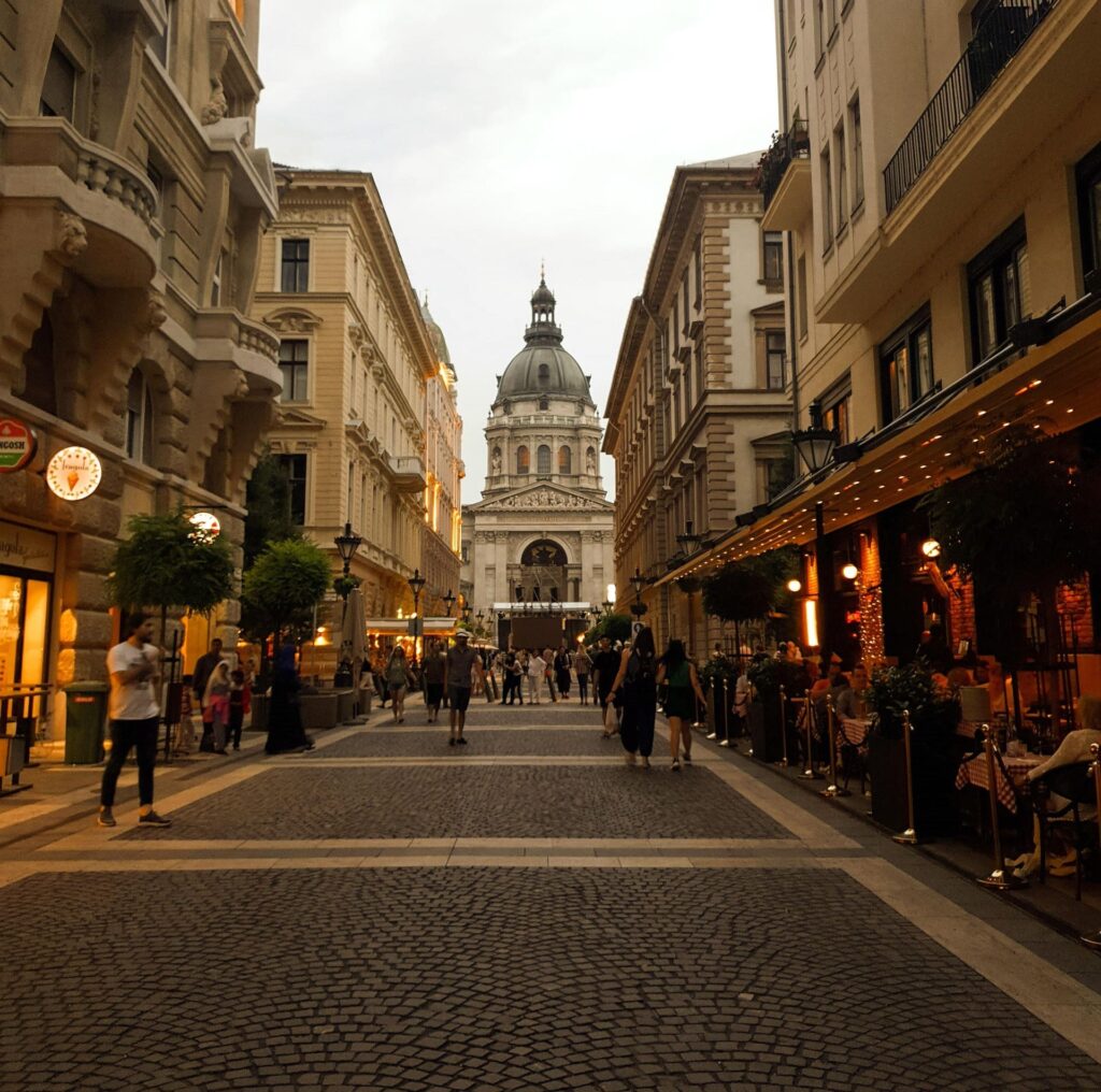Pedestrian street lined with shops and restaurants.
