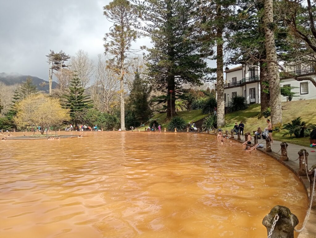 Circular enclosure on a hot spring with brownish water