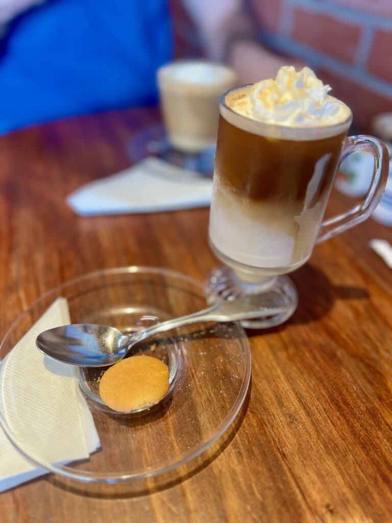 Coffee in a glass topped with cream