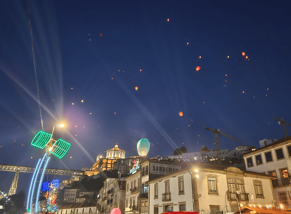 Lantern floating in the sky above a city scape