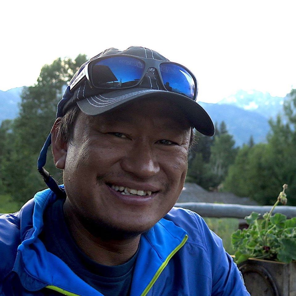 Man in cap smiling for camera