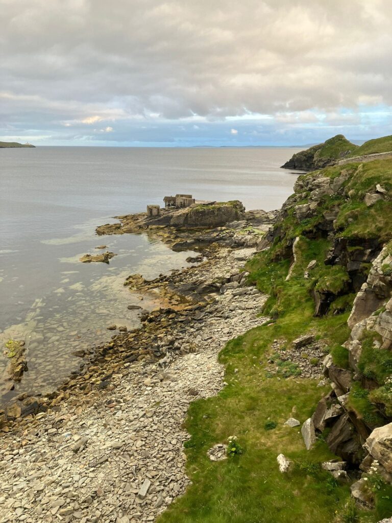 View of water from grassy cliffs