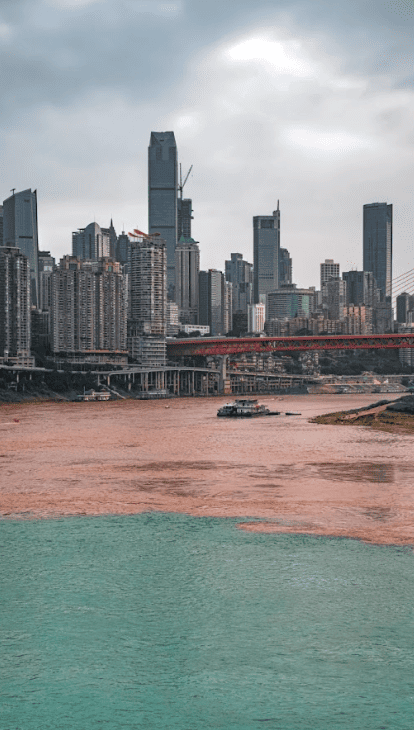 Confluence of two rivers in a skyscraper dominated cityscape