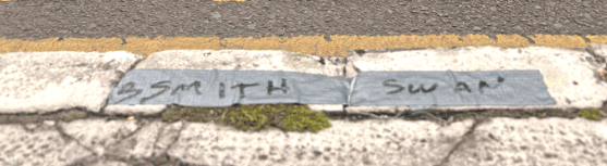 Family names written on side of street
