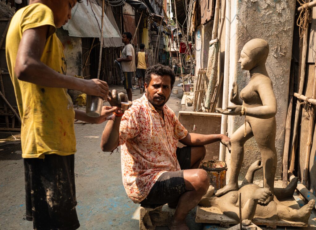Pottery maker making statue