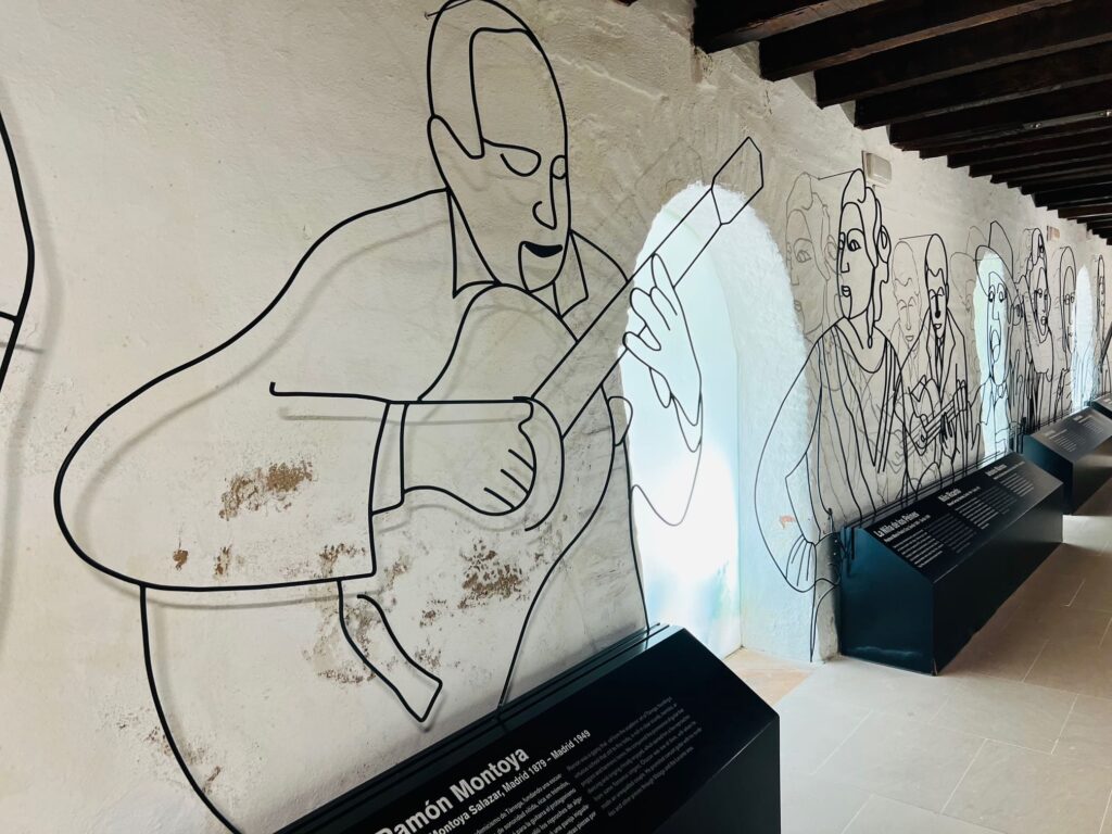 Cartoon drawing of man with guitar in museum space