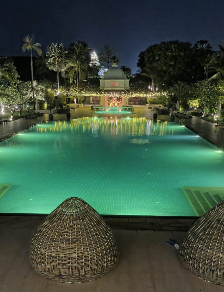 Lit pool with with green surroundings