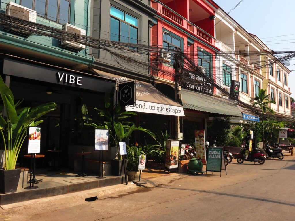 Street facade with cafes that have outdoor pavement seating