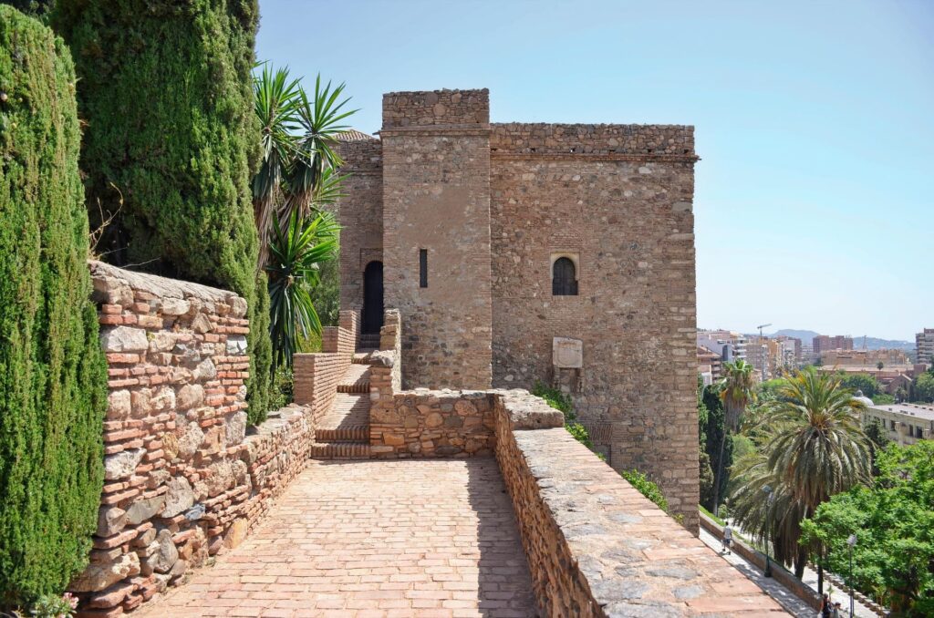 Old castle with trees overlooking a city