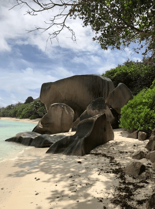 Smooth boulders and rocks on tropical beach