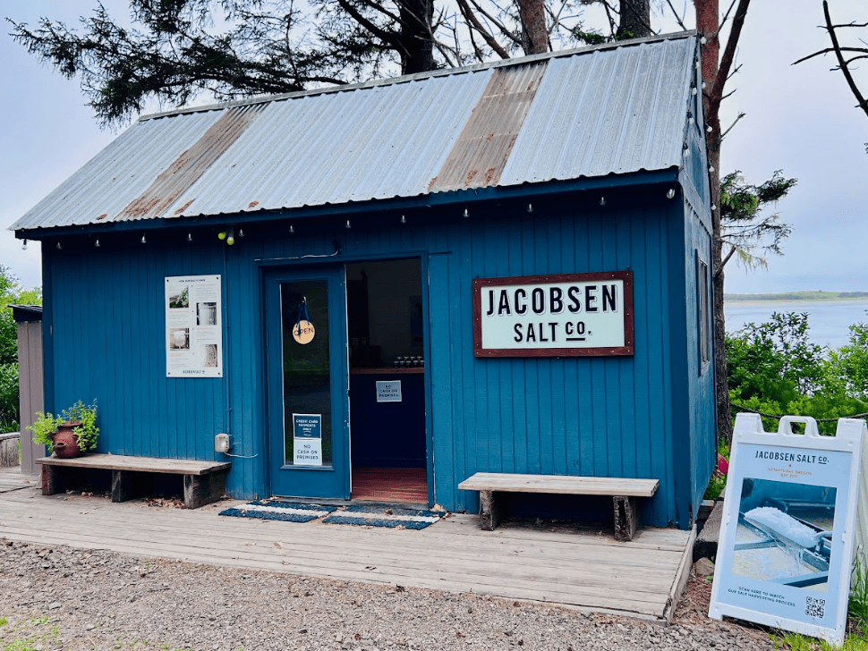 A blue small house with a sign saying Jacobsen Salt
