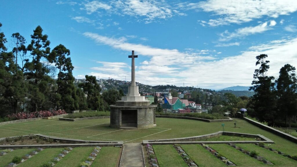 Shrine with cross overlooking a urban setting