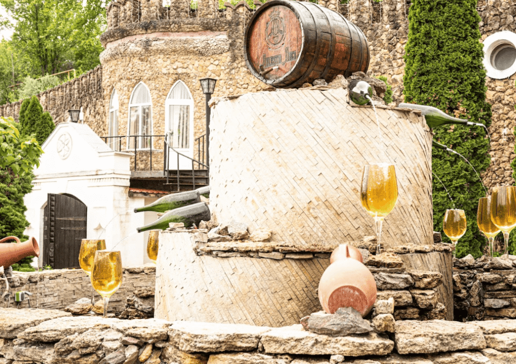 Glasses of wine placed ona stone fountain